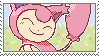 Stamp with Skitty the pink cat Pokemon in a field of flowers.